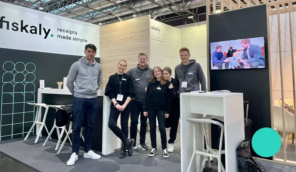 fiskaly team members at the EuroCIS booth